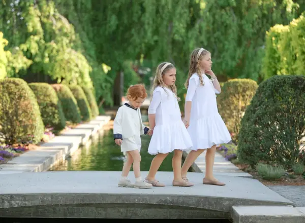 Four sisters walking along a garden path, outdoor photography by Photoholic, Rockland County NY