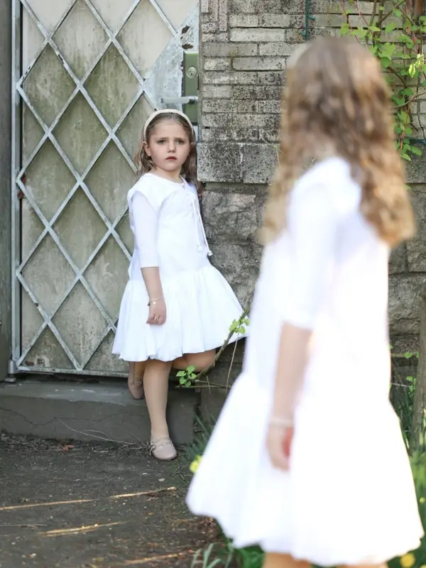 Two girls in white dresses by a stone house, outdoor photography by Photoholic, Rockland County NY
